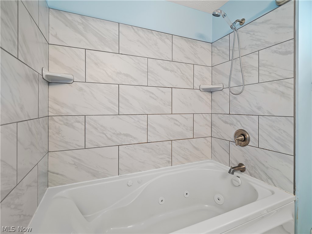 19155 Drake Road Strongsville, OH 44149 - Photo 14 of 29 Bathroom with tiled shower / bath combo