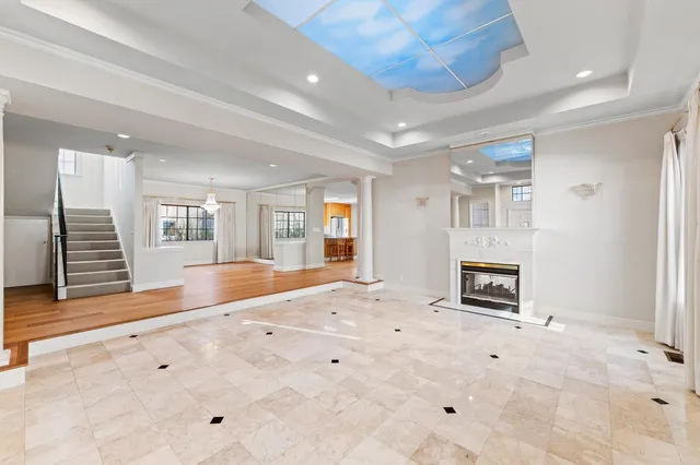 a view of livingroom with hardwood floor and a fireplace