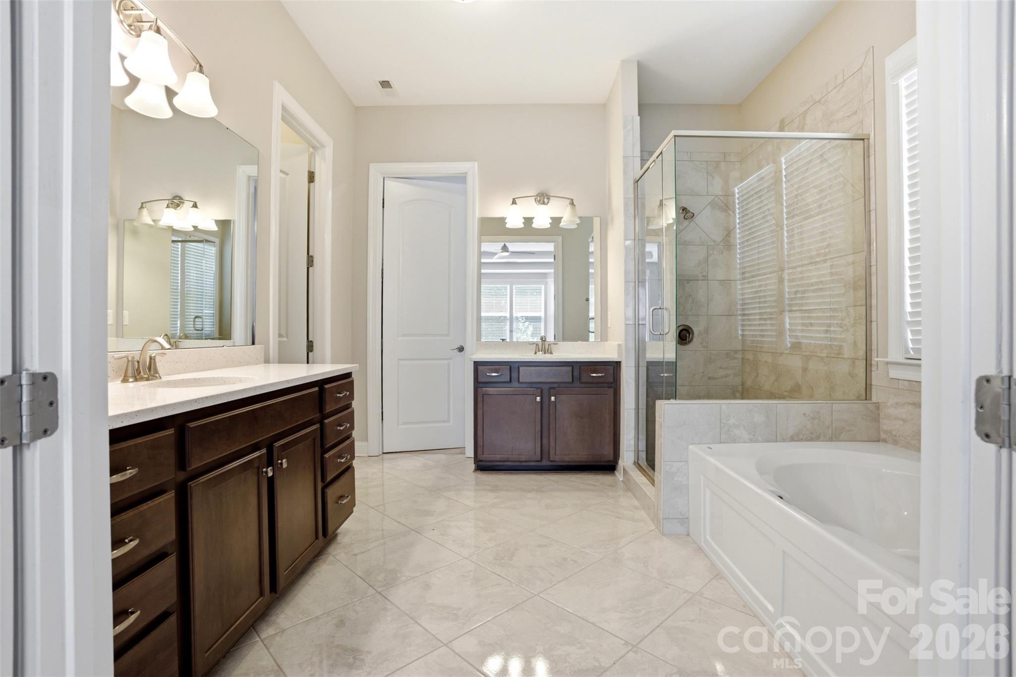 14022 Salem Ridge Road Huntersville, NC 28078 - Photo 17 of 38 a spacious bathroom with a tub sink shower and mirror