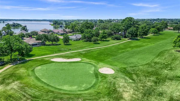 a view of a golf course with a lake