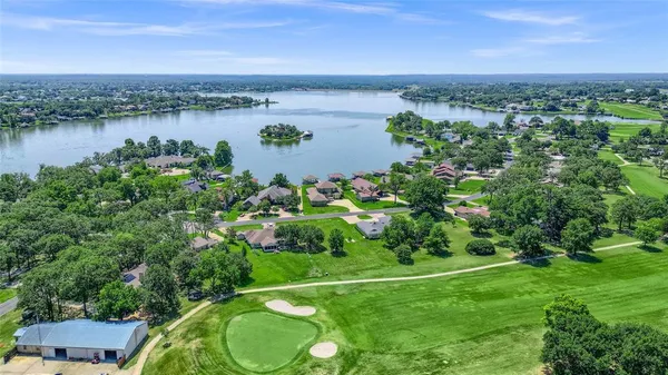 a view of a lake with a yard