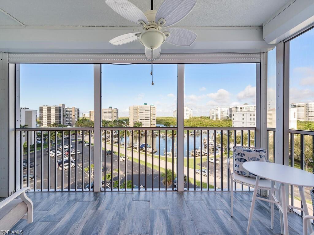 1 Bluebill Avenue, Unit 703 Naples, FL 34108 - Photo 11 of 31 a view of a balcony with furniture