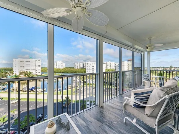 a view of a balcony with furniture