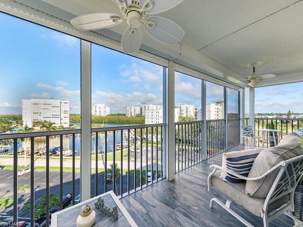1 Bluebill Avenue, Unit 703 Naples, FL 34108 - Photo 12 of 31 a view of a balcony with furniture