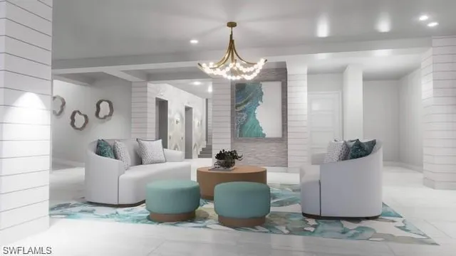 a living room with furniture and a chandelier