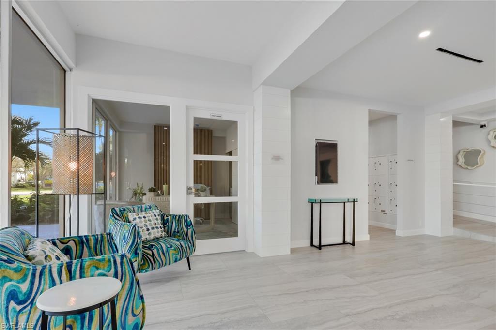 1 Bluebill Avenue, Unit 703 Naples, FL 34108 - Photo 20 of 31 a view of a livingroom with furniture and front door