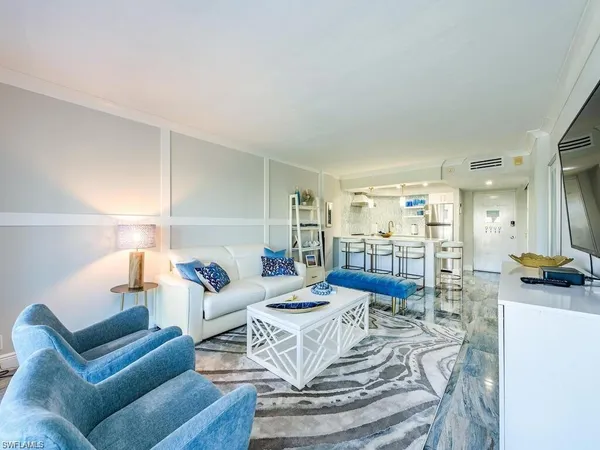 a living room with furniture and a table