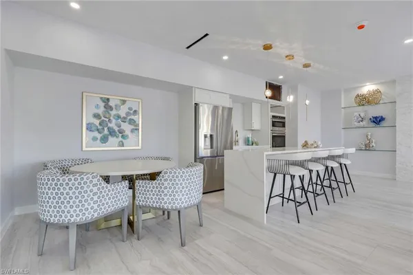 a view of kitchen with furniture and wooden floor