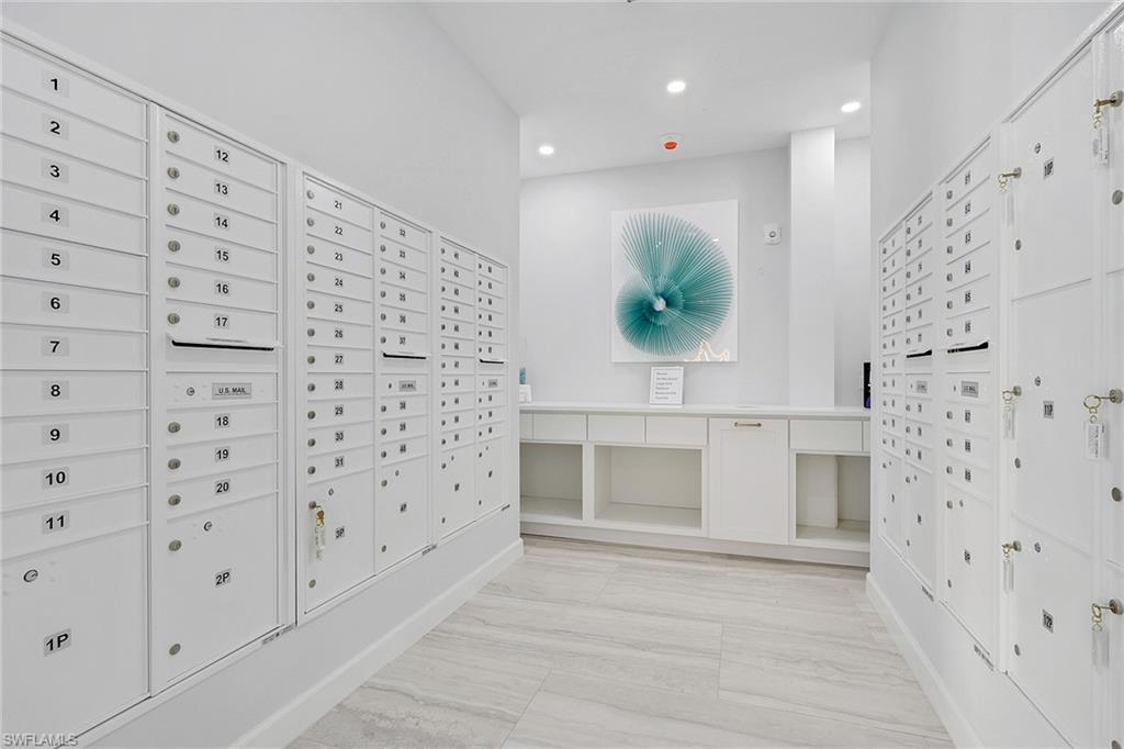 1 Bluebill Avenue, Unit 703 Naples, FL 34108 - Photo 29 of 31 a view of cabinets with entryway