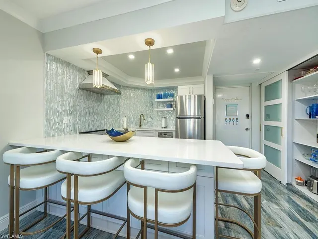 a kitchen with a table and chairs in it