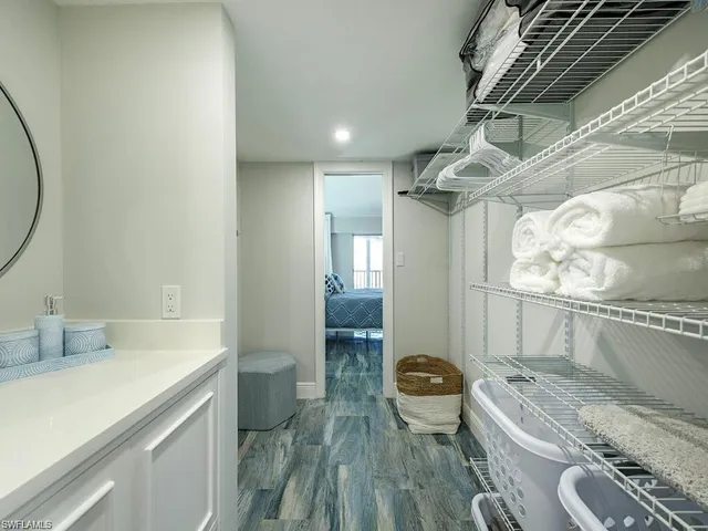 a bathroom with a granite countertop sink a toilet and bathtub