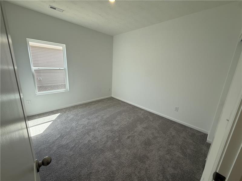 4001 Chakeres Avenue Springfield, OH 45505 - Photo 12 of 15 This cozy bedroom provides a comfortable retreat with ample natural light.