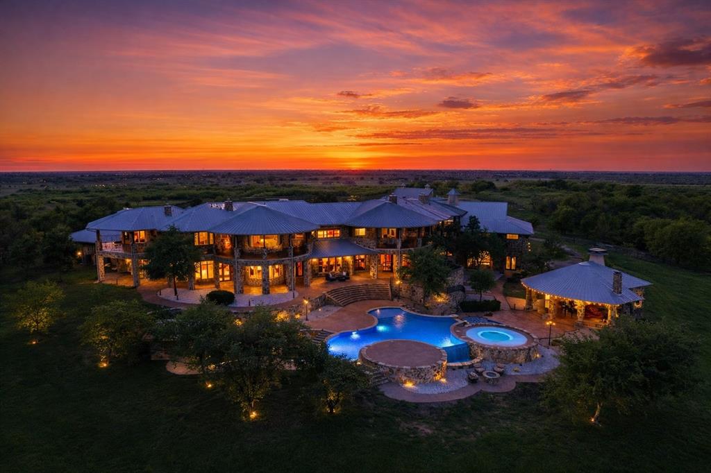 1180 McReynolds Road Sanger, TX 76266 - Photo 3 of 40 Expansive estate featuring multiple levels of covered outdoor living spaces, a freeform swimming pool, an integrated spa, and a separate covered pavilion
