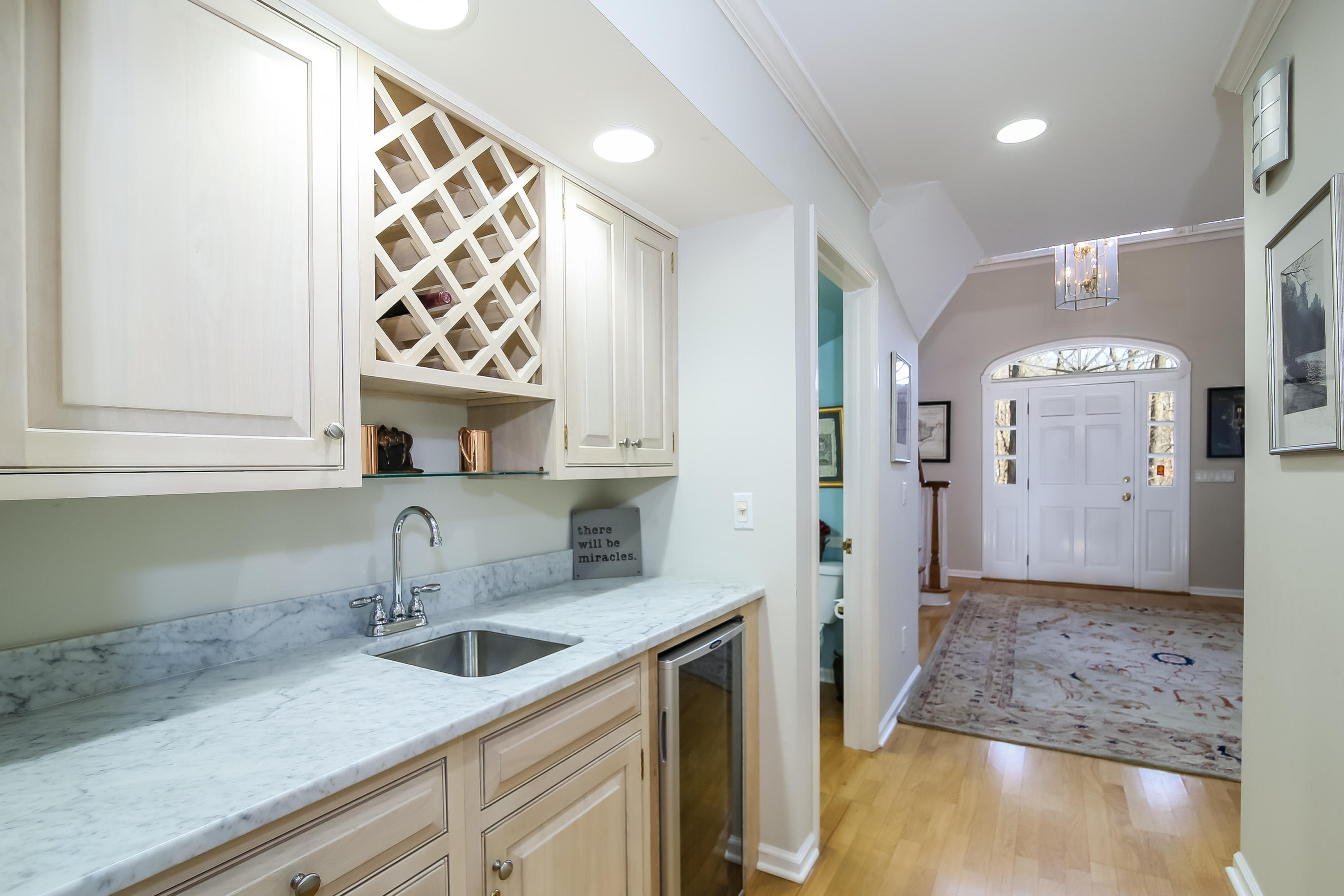 228 Laurel Road New Canaan, CT 06840 - Photo 12 of 38 a kitchen with stainless steel appliances granite countertop a sink and a refrigerator