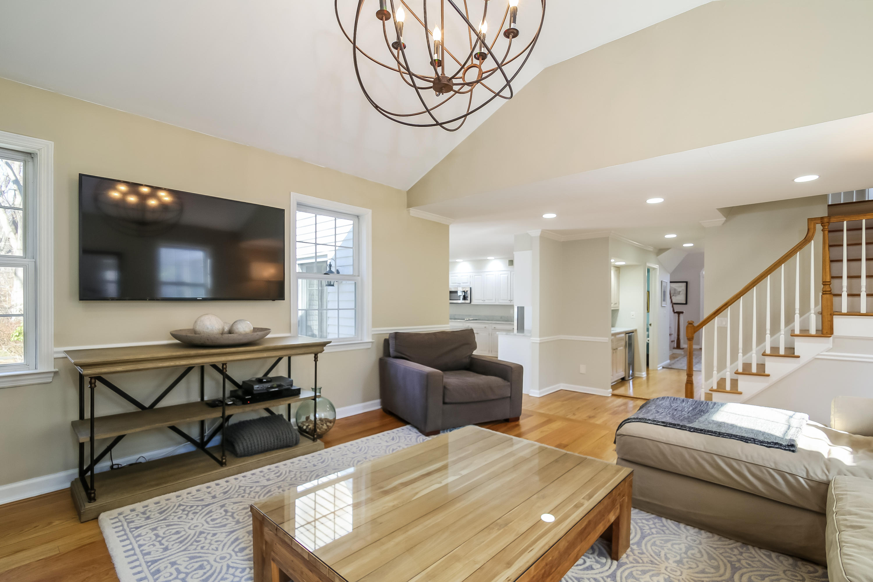 228 Laurel Road New Canaan, CT 06840 - Photo 14 of 38 a living room with furniture and a flat screen tv