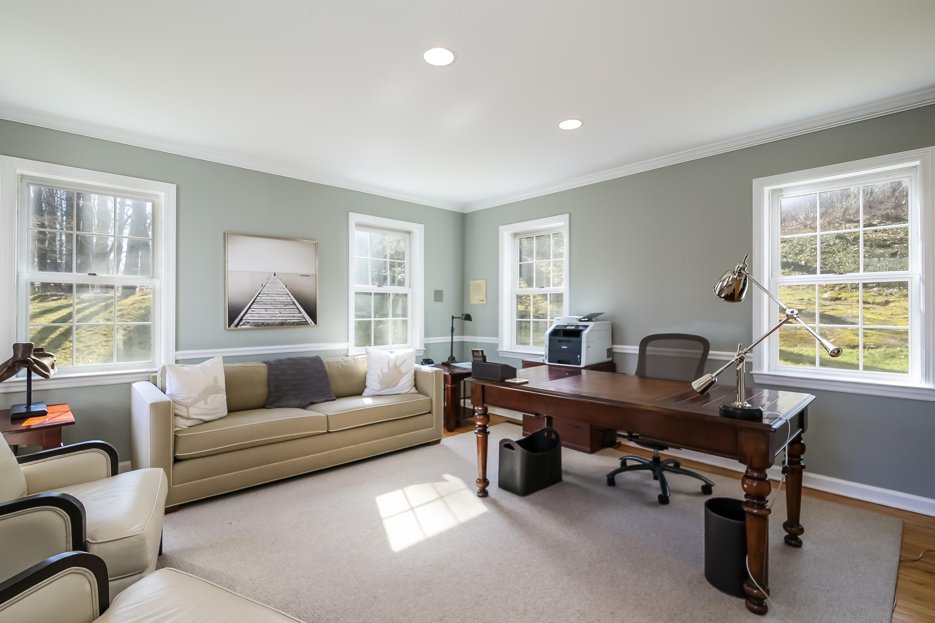 228 Laurel Road New Canaan, CT 06840 - Photo 16 of 38 a livingroom with workspace couch and a window