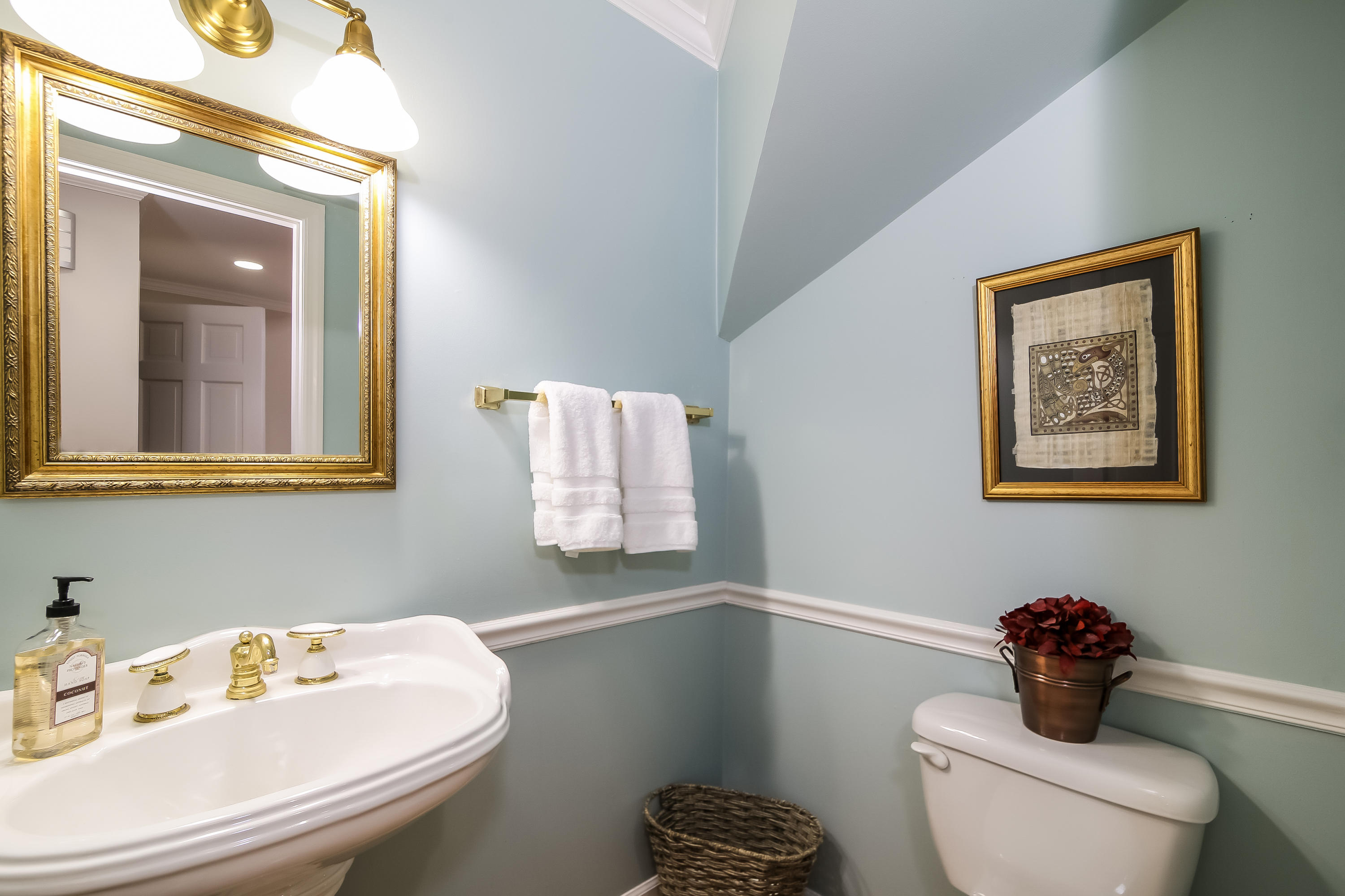 228 Laurel Road New Canaan, CT 06840 - Photo 20 of 38 a bathroom with a toilet a sink and mirror
