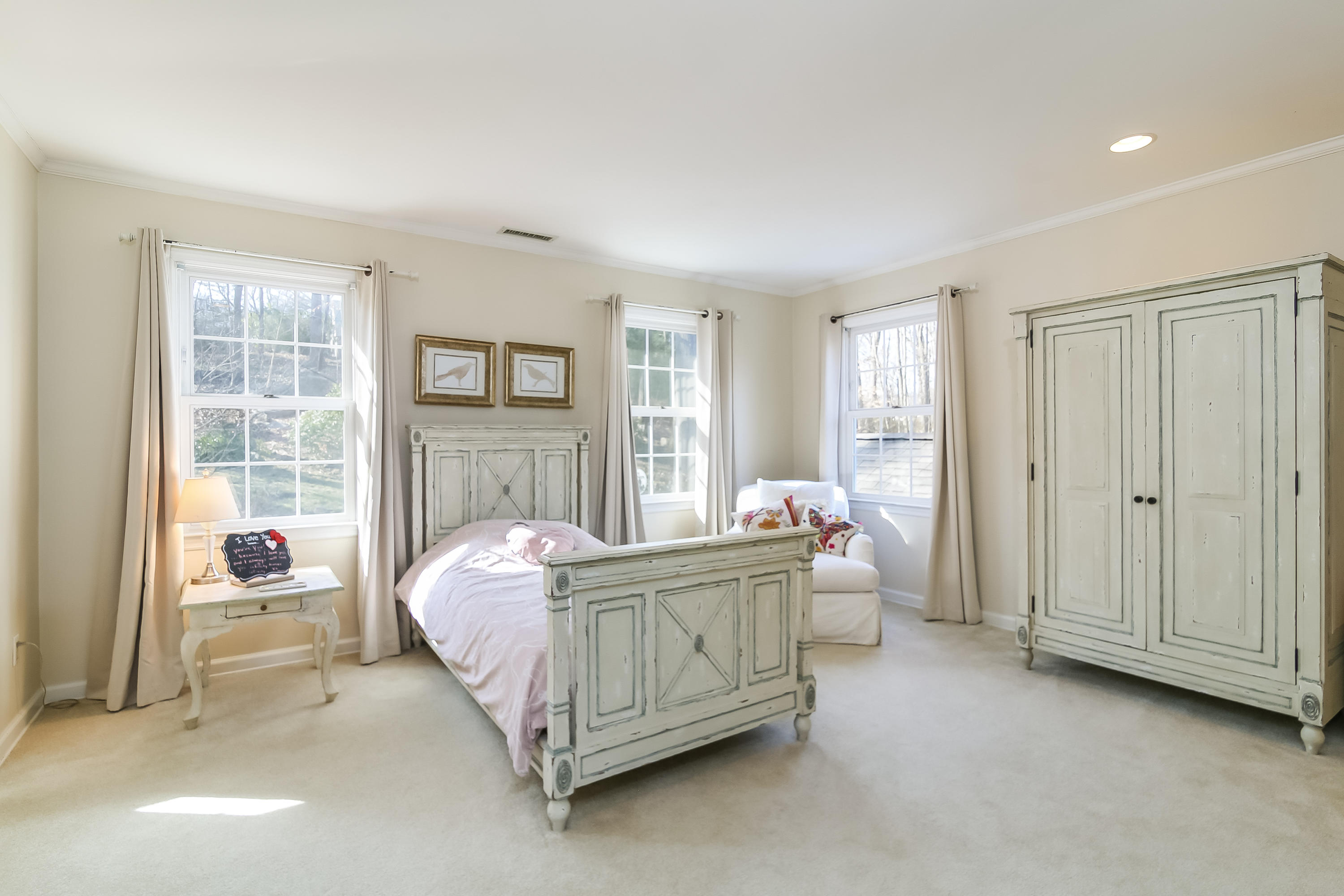 228 Laurel Road New Canaan, CT 06840 - Photo 27 of 38 a bed room with a bed and a window