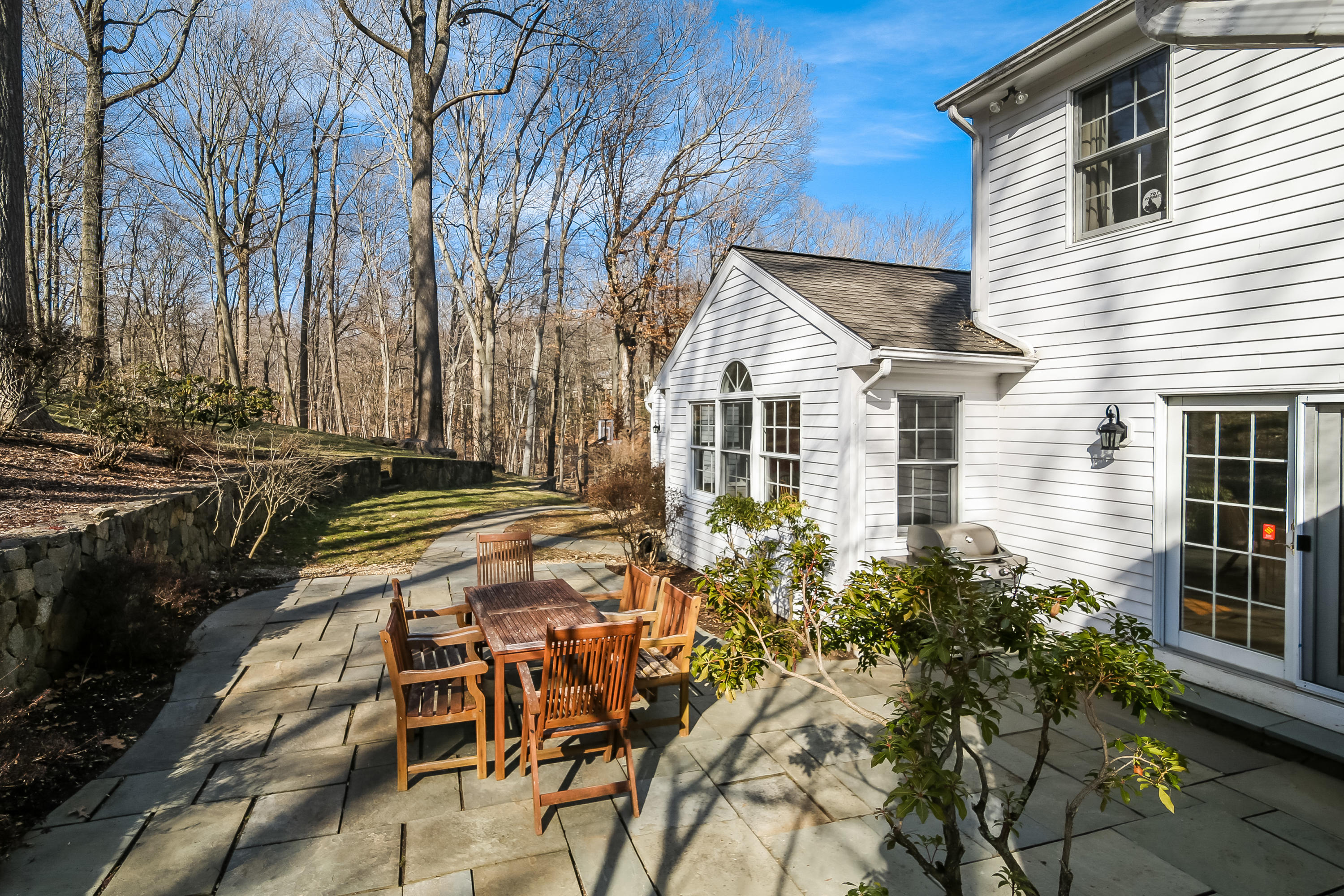228 Laurel Road New Canaan, CT 06840 - Photo 33 of 38 front view of a house with a yard