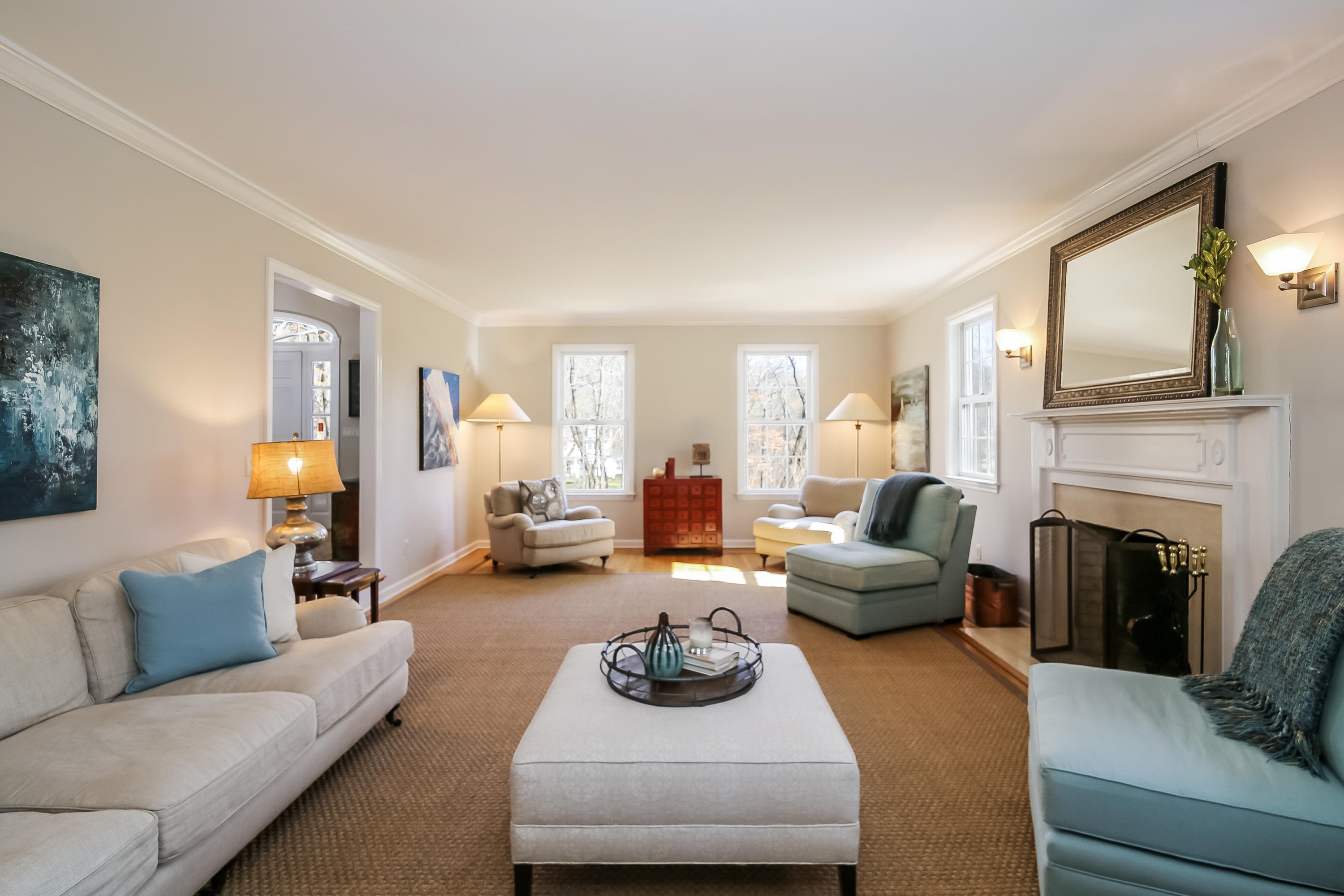 228 Laurel Road New Canaan, CT 06840 - Photo 4 of 38 a living room with furniture fireplace and a large window