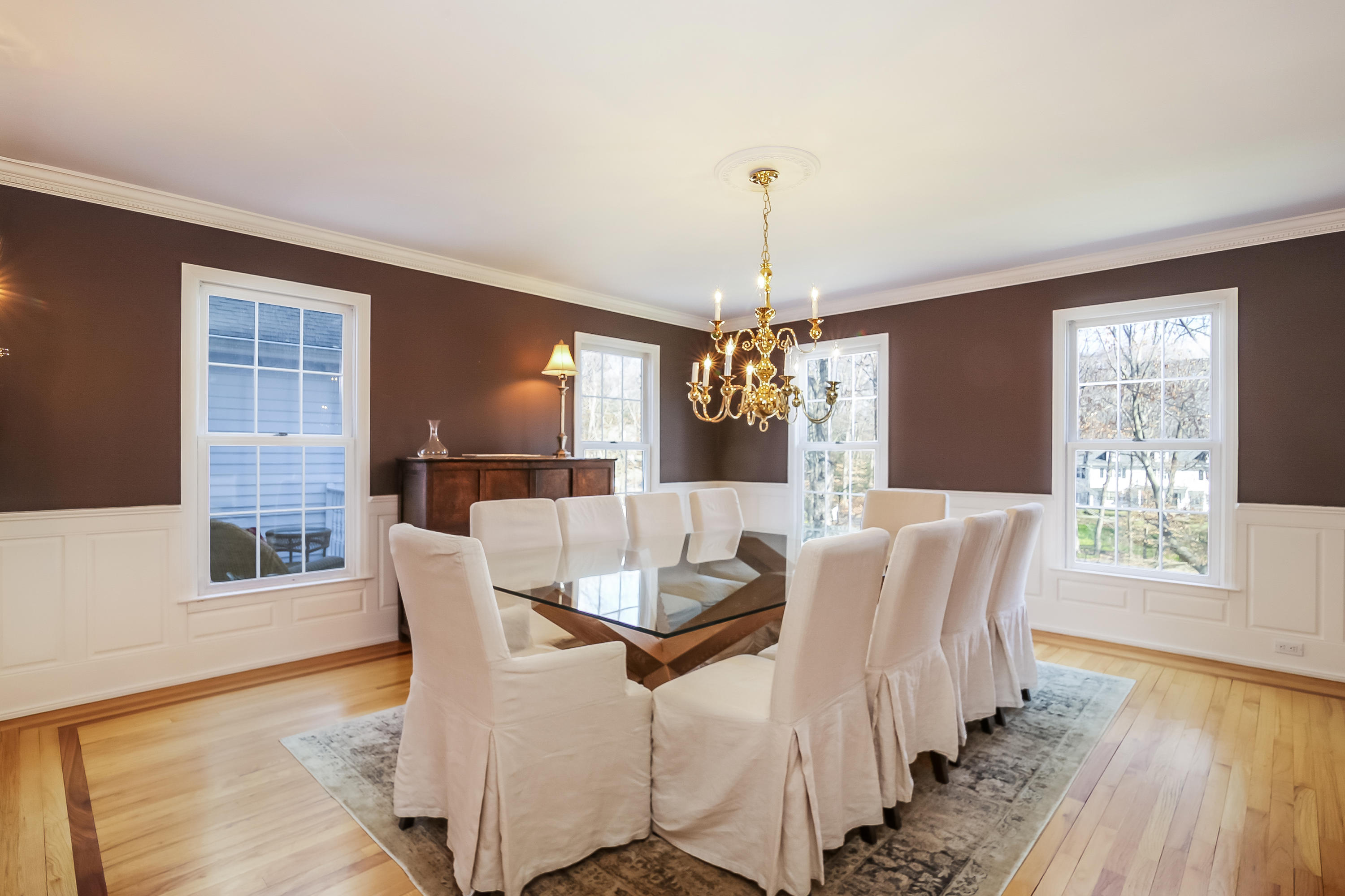 228 Laurel Road New Canaan, CT 06840 - Photo 5 of 38 a view of a dining room with furniture window and wooden floor