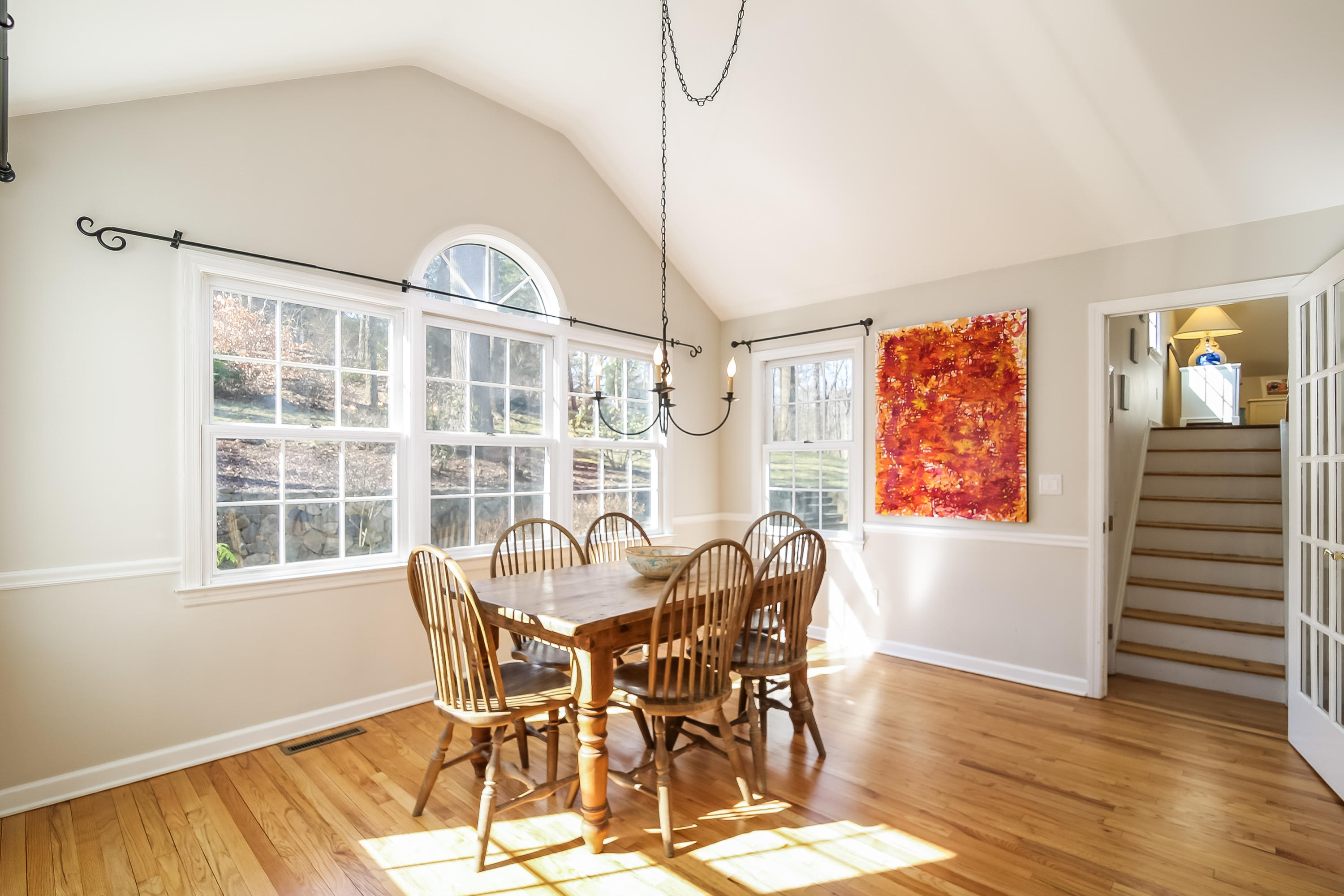 228 Laurel Road New Canaan, CT 06840 - Photo 6 of 38 a view of a dining room with furniture window and wooden floor
