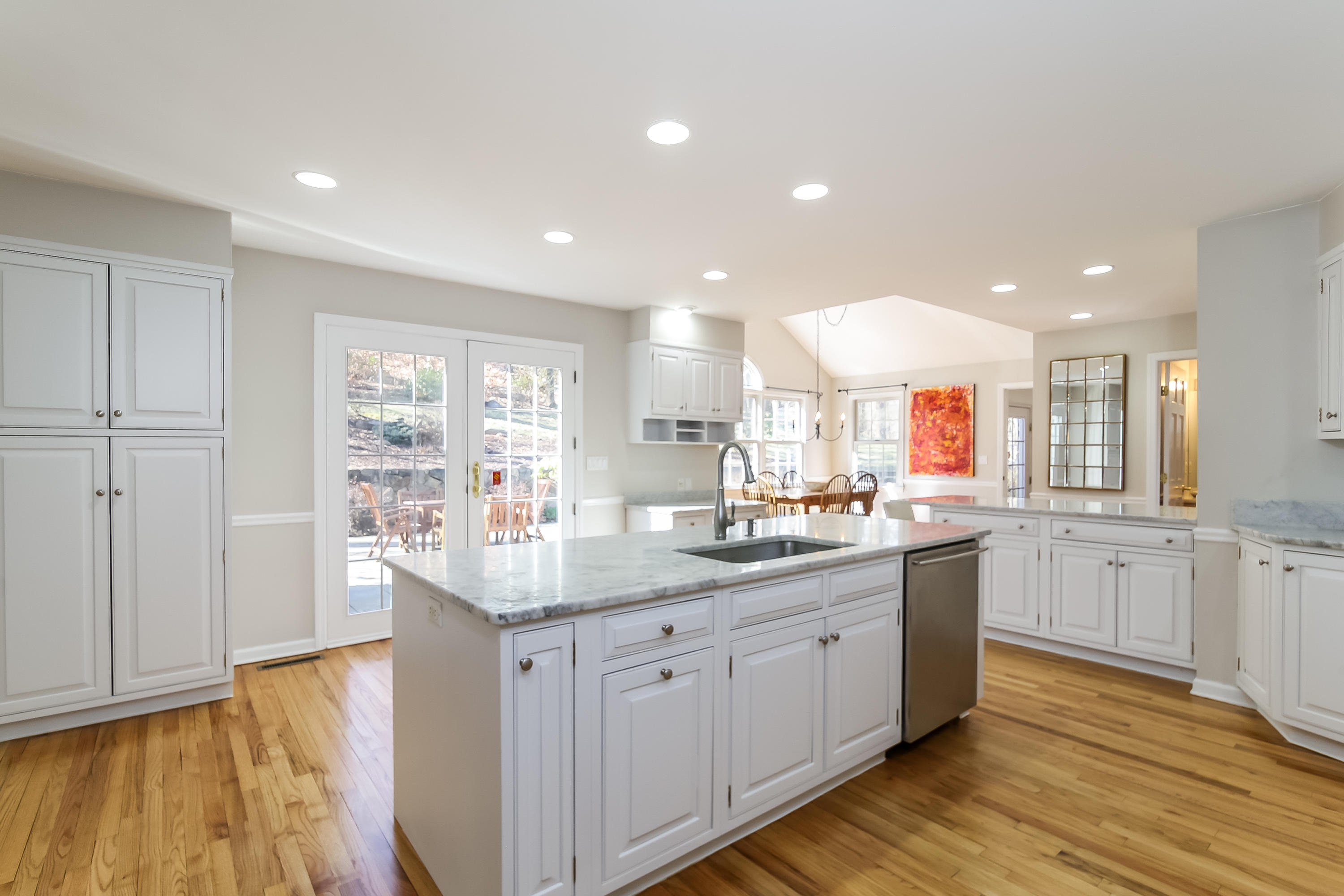 228 Laurel Road New Canaan, CT 06840 - Photo 9 of 38 a kitchen with granite countertop a sink and cabinets
