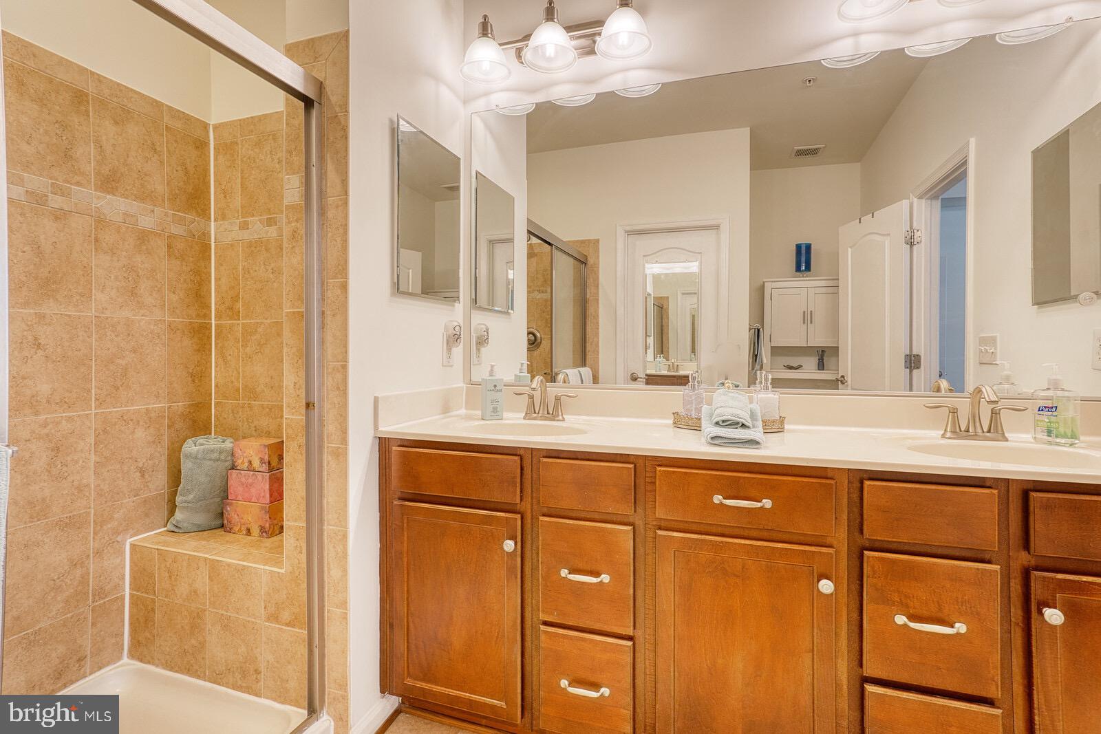 13113 Winding Trail Road Laurel, MD 20707 - Photo 21 of 37 LIGHT & BRIGHT PRIMARY BATH FEATURES DUAL SINKS