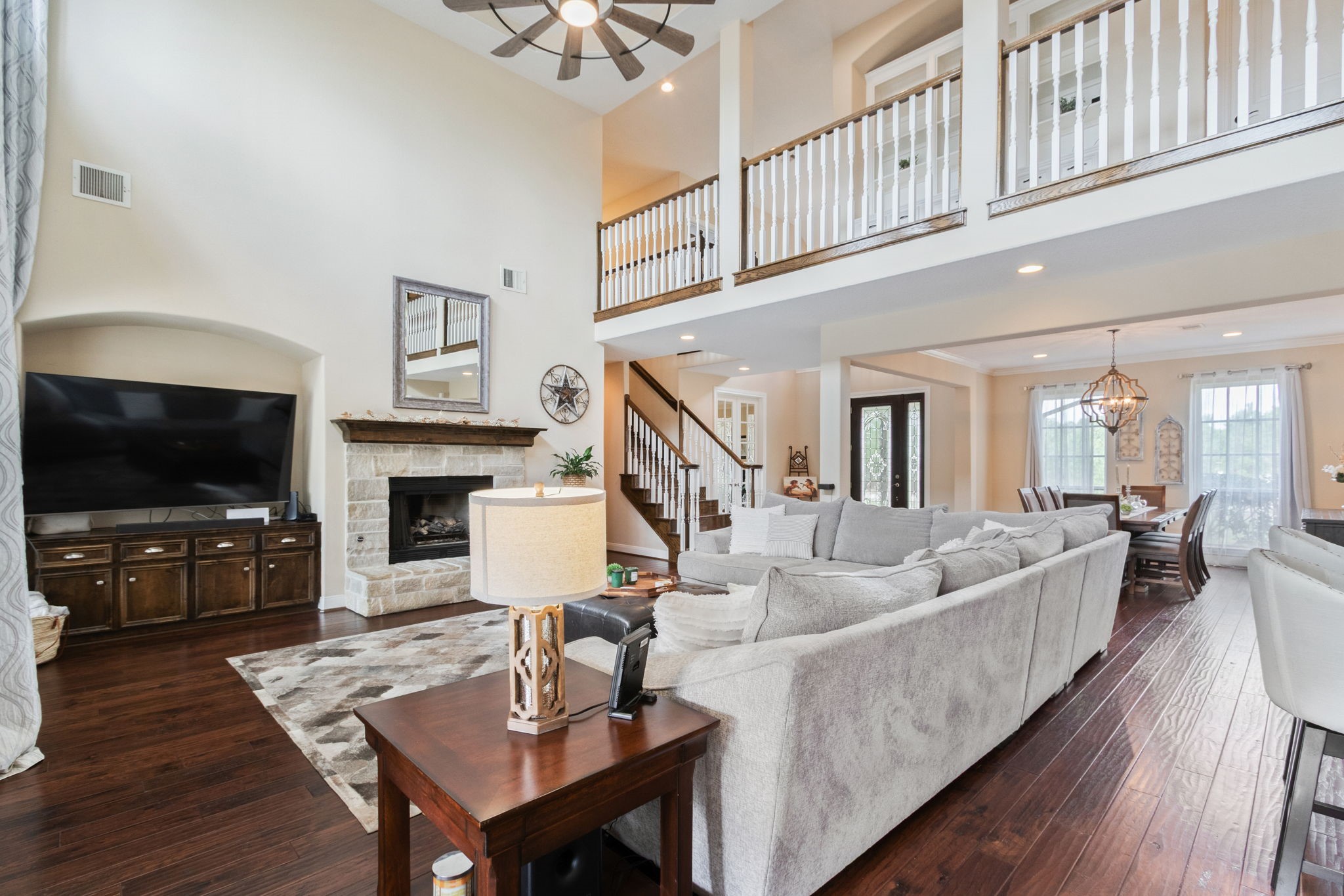 26231 Crown Ranch Boulevard Montgomery, TX 77316 - Photo 11 of 46 a living room with fireplace furniture and a flat screen tv