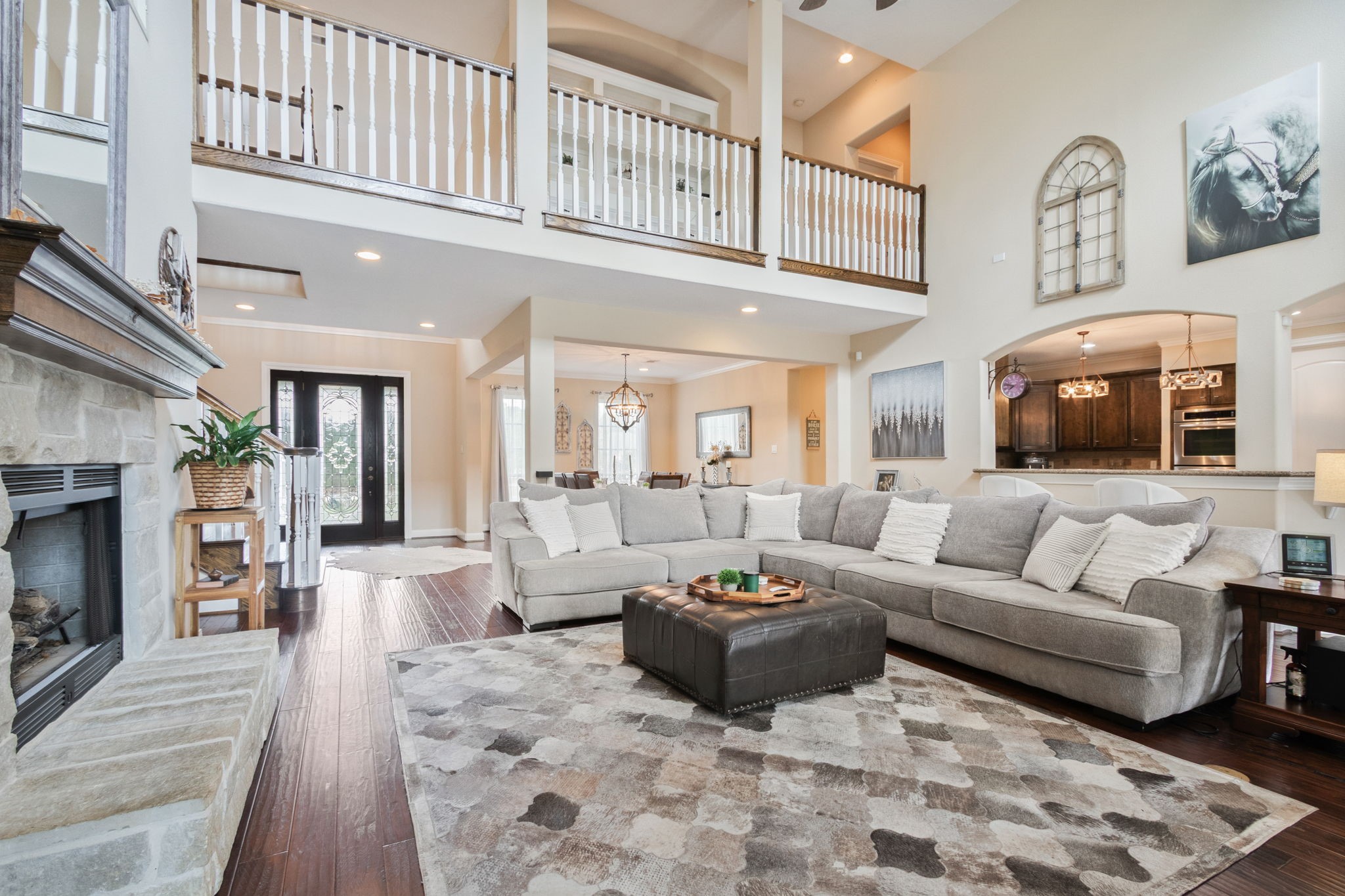 26231 Crown Ranch Boulevard Montgomery, TX 77316 - Photo 12 of 46 a living room with furniture and a fireplace