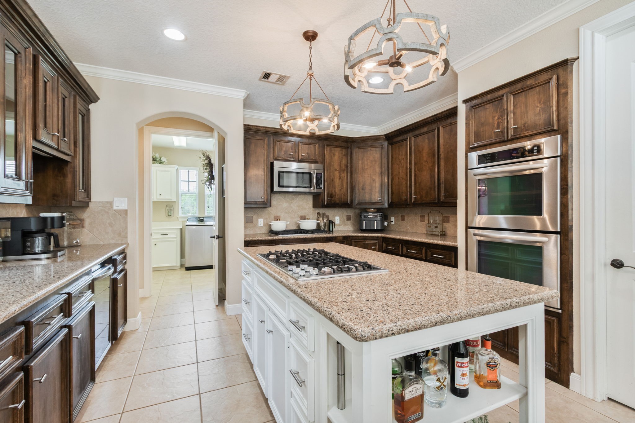 26231 Crown Ranch Boulevard Montgomery, TX 77316 - Photo 15 of 46 a kitchen with stainless steel appliances granite countertop a stove refrigerator and cabinets
