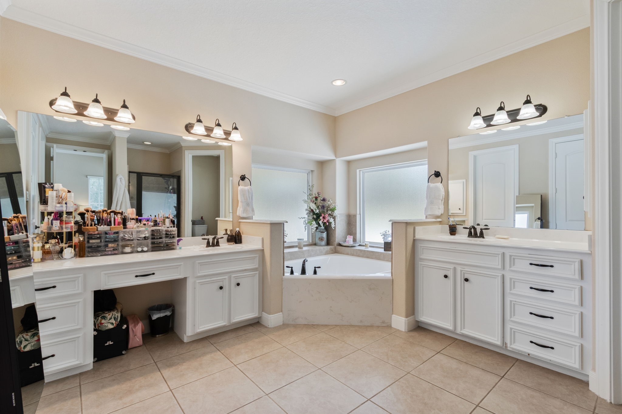 26231 Crown Ranch Boulevard Montgomery, TX 77316 - Photo 19 of 46 a spacious en suite bathroom with a double vanity sink mirror and bathtub