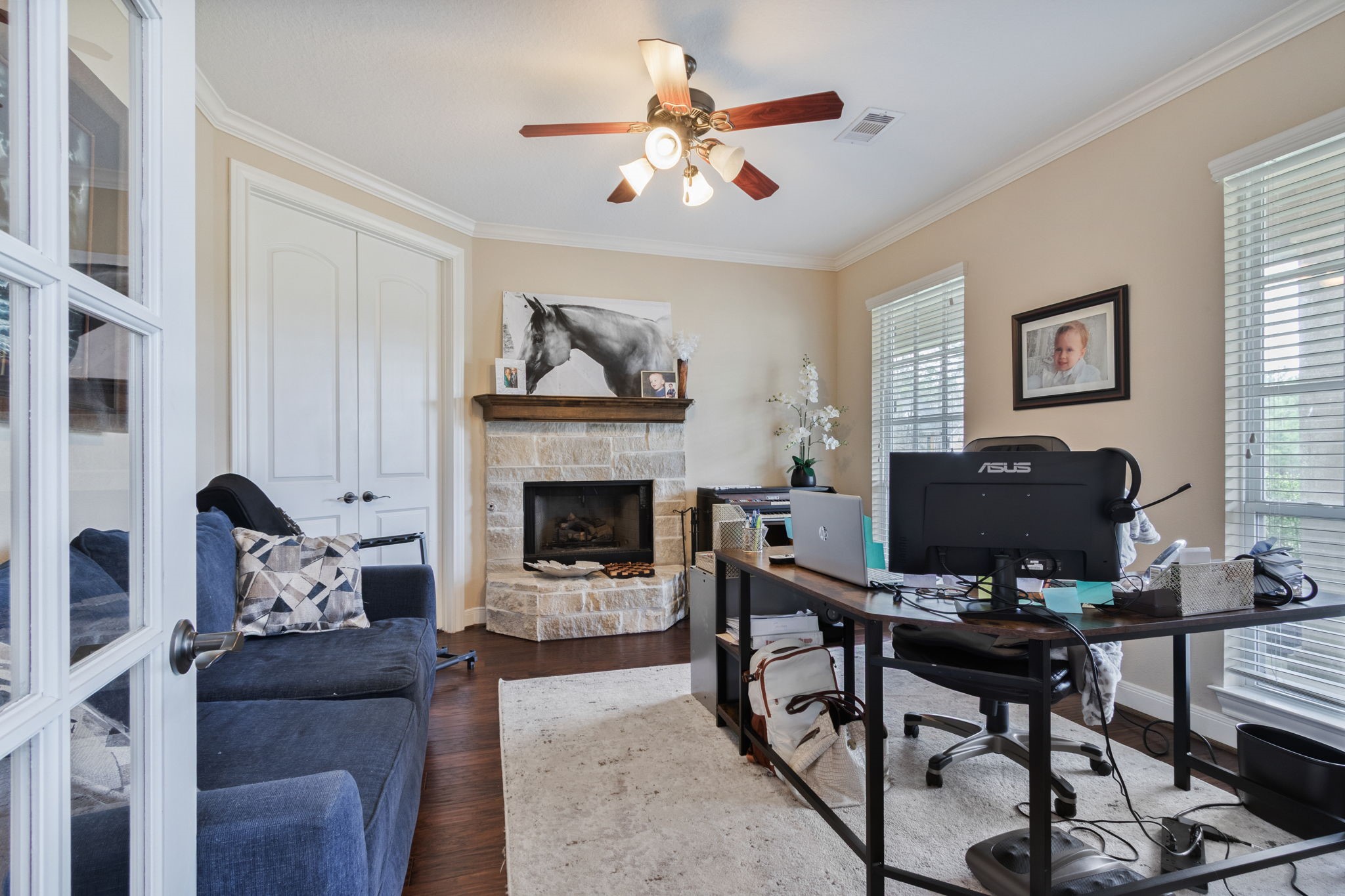 26231 Crown Ranch Boulevard Montgomery, TX 77316 - Photo 8 of 46 a living room with furniture and a fireplace