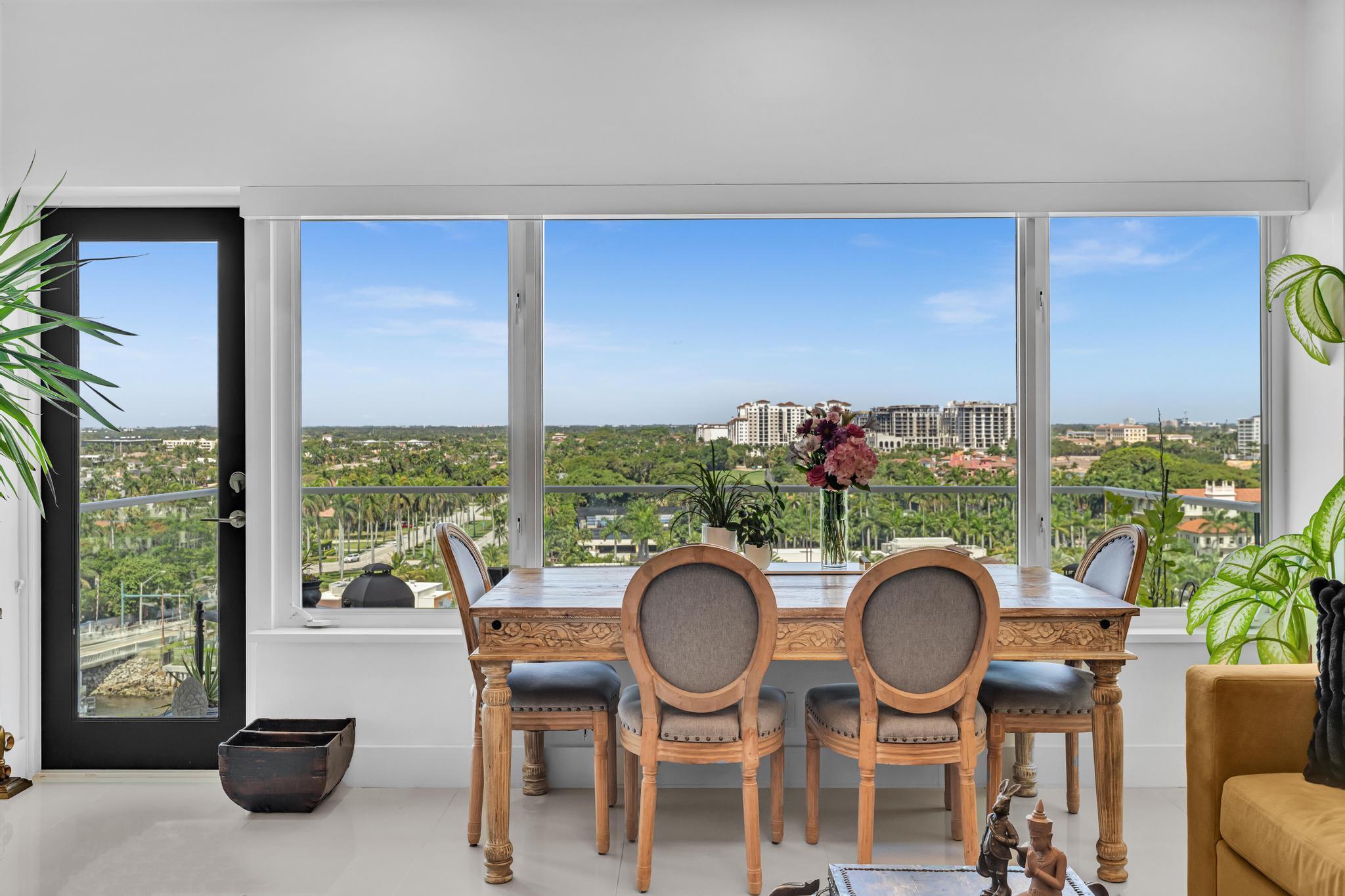 701 East Camino Real, Unit 12G Boca Raton, FL 33432 - Photo 10 of 82 a dining room with furniture a rug and wooden floor