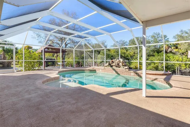 a view of a chairs and table in the balcony