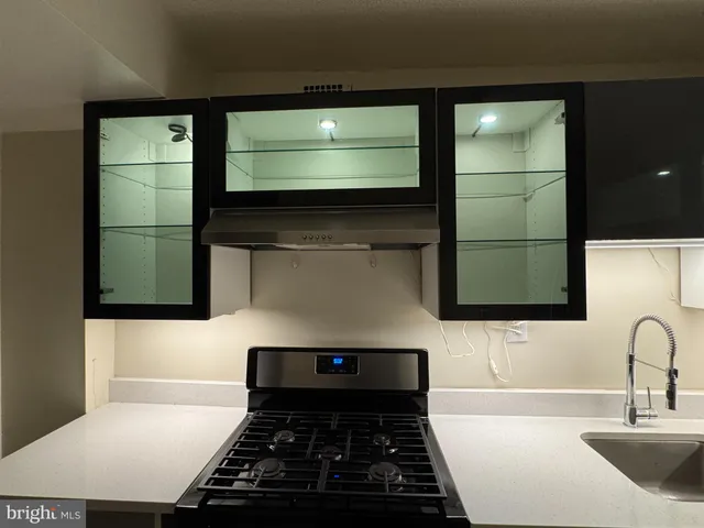 a bathroom with a sink and a washing machine