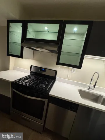 a kitchen with a stove and a sink