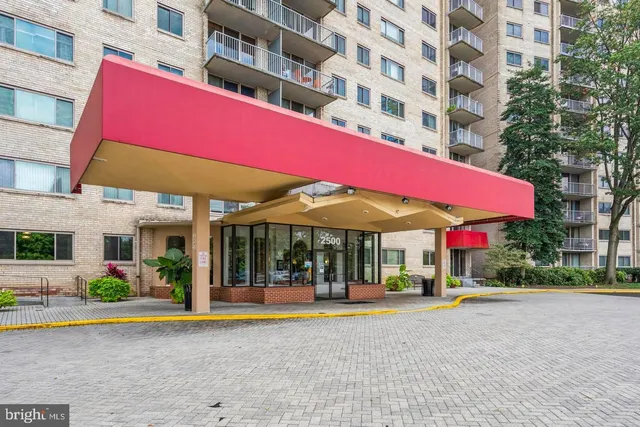 a view of a building with a swimming pool