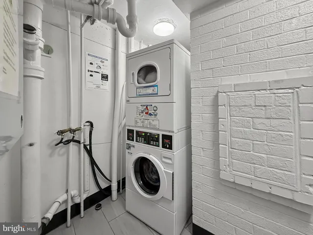 a view of a storage & utility room with washer and dryer