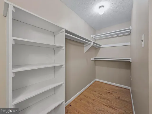 a view of an empty walk in closet