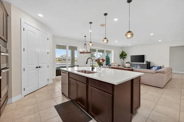 a bed room with a bed and a flat tv screen