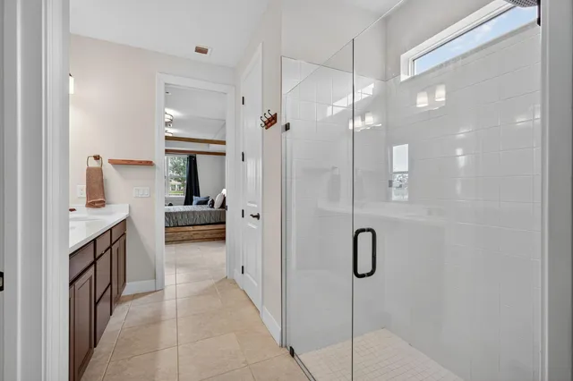 a bathroom with a glass shower door