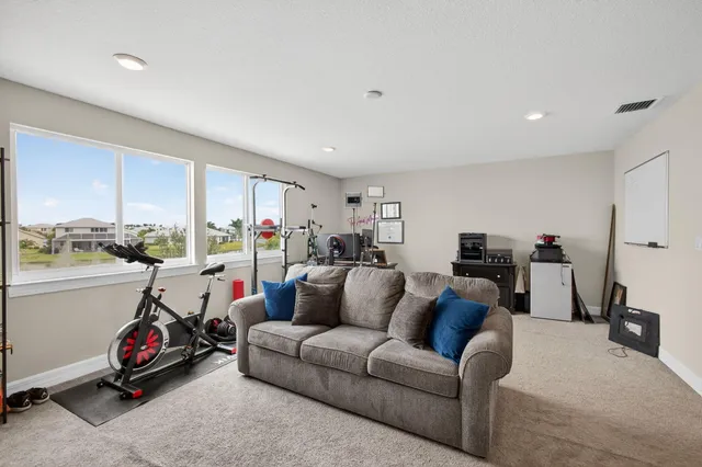 a bathroom with a double vanity sink toilet and mirror
