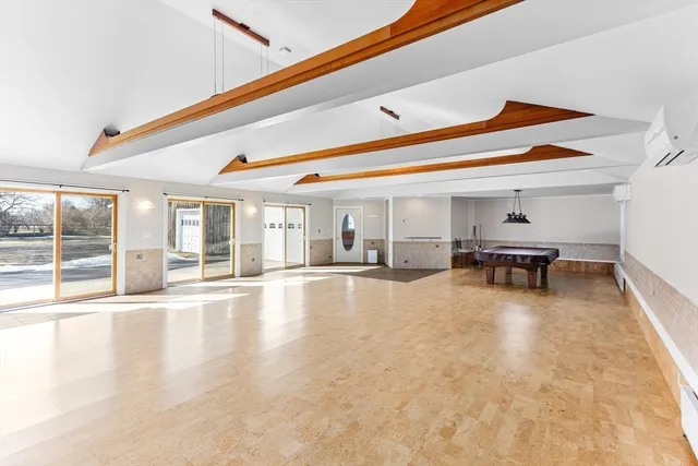 a swimming pool with outdoor seating and windows