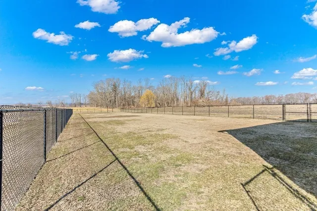 a view of a backyard of the house
