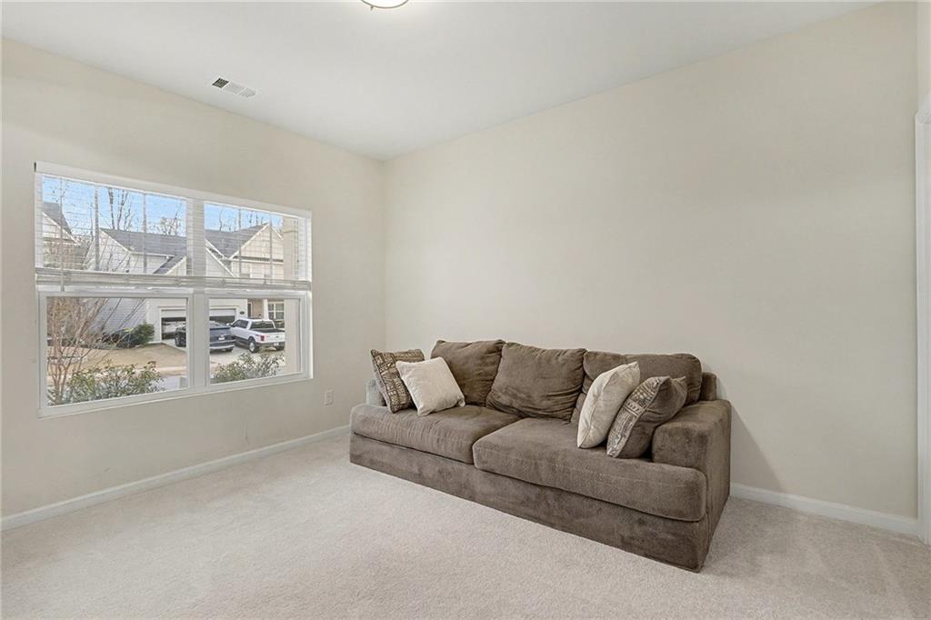 310 Coppergate Court Canton, GA 30115 - Photo 14 of 32 a living room with furniture and a window