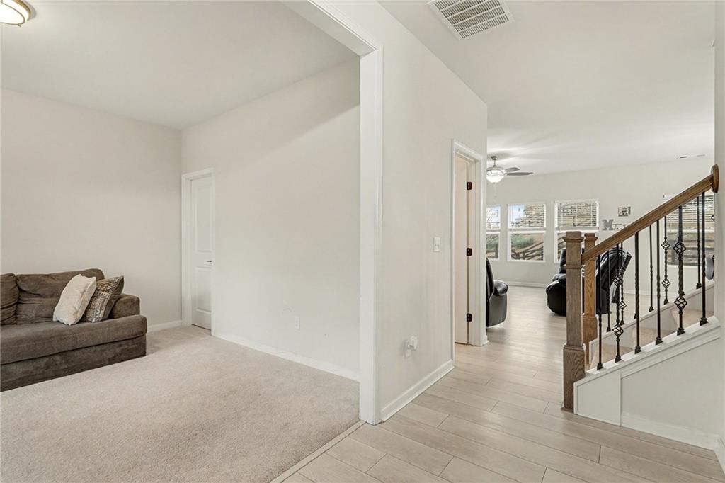 310 Coppergate Court Canton, GA 30115 - Photo 15 of 32 a living room with furniture and a couch