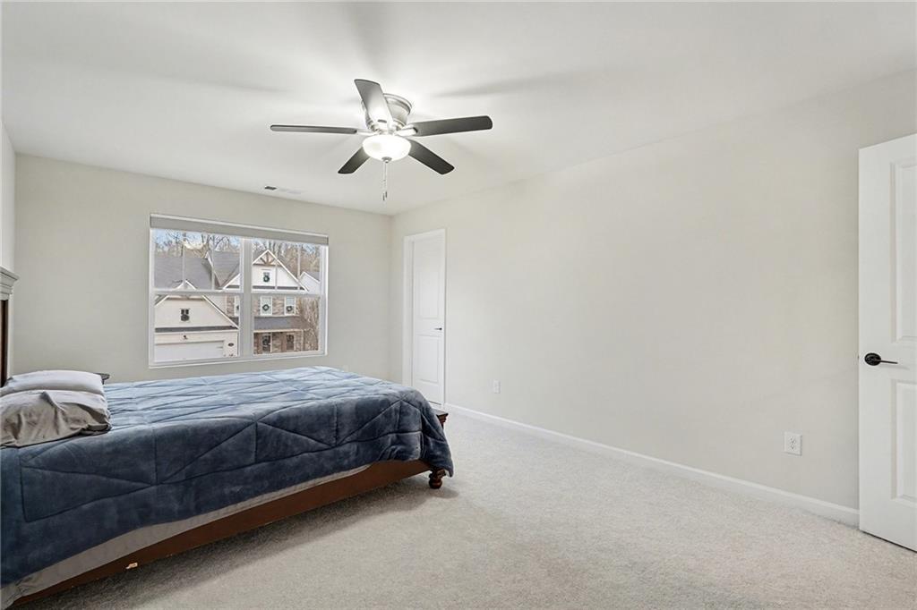 310 Coppergate Court Canton, GA 30115 - Photo 20 of 32 a bedroom with a bed and window