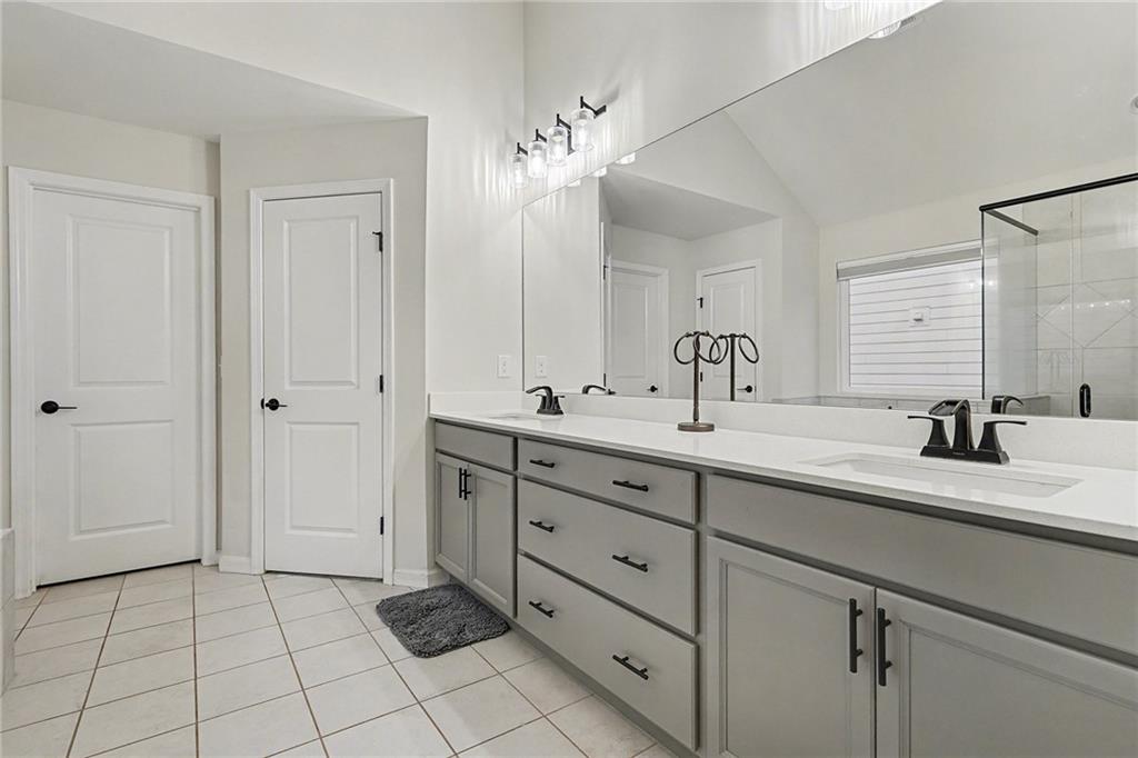 310 Coppergate Court Canton, GA 30115 - Photo 27 of 32 a bathroom with a double vanity sink mirror and