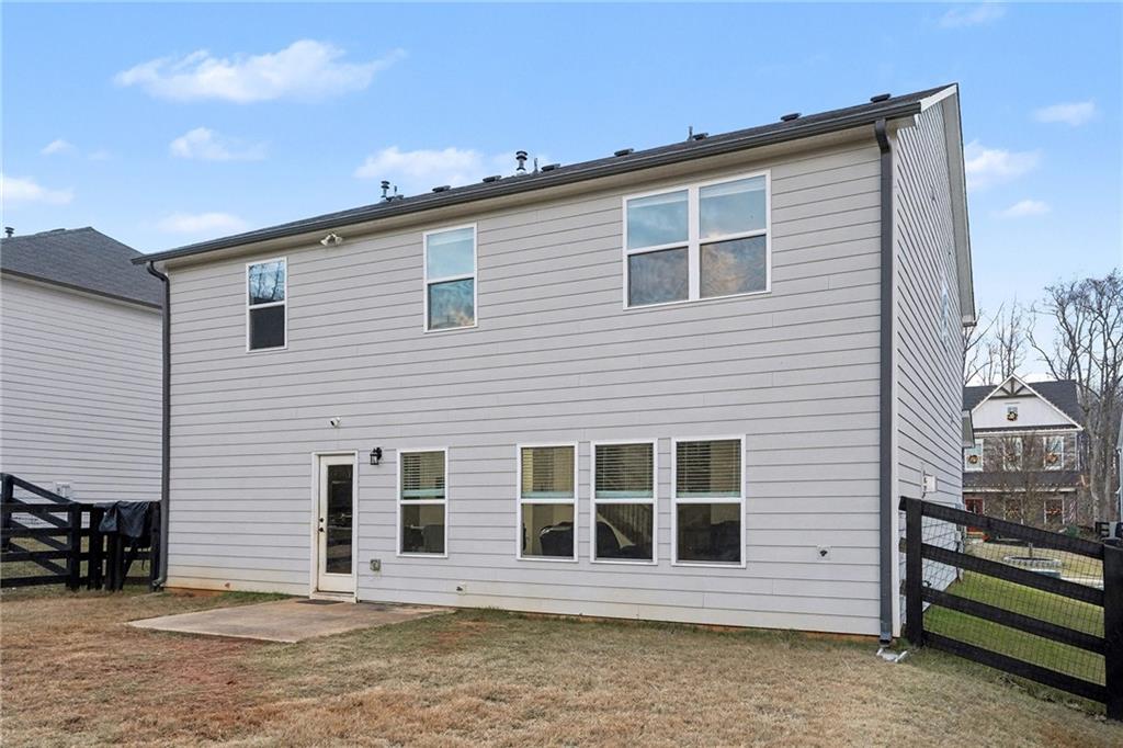 310 Coppergate Court Canton, GA 30115 - Photo 30 of 32 a front view of a house with a yard